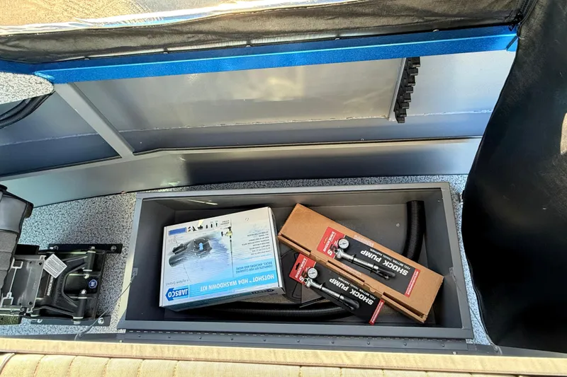 Slide: The Image of 2026 Alumaweld Intruder Outboard 22 boat interior with blue and gray design. - 23