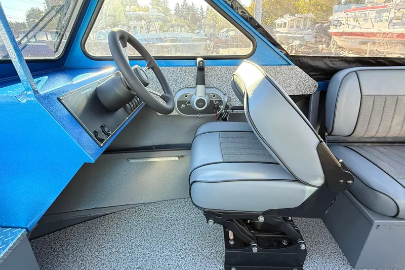 Slide: The Image of 2026 Alumaweld Intruder Outboard 22 boat interior storage compartment, blue finish. - 27