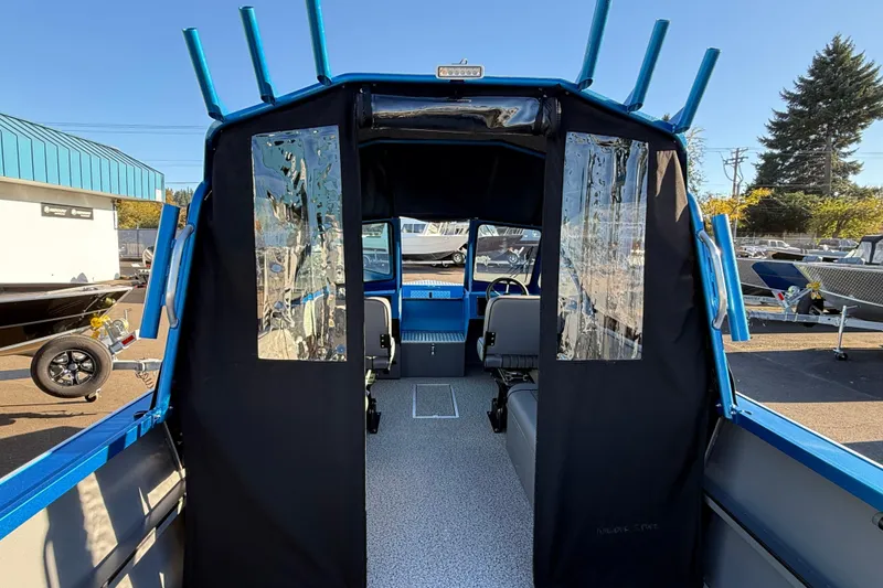 Slide: The Image of 2026 Alumaweld Intruder Outboard 22 boat interior with seating and rod holders. - 7