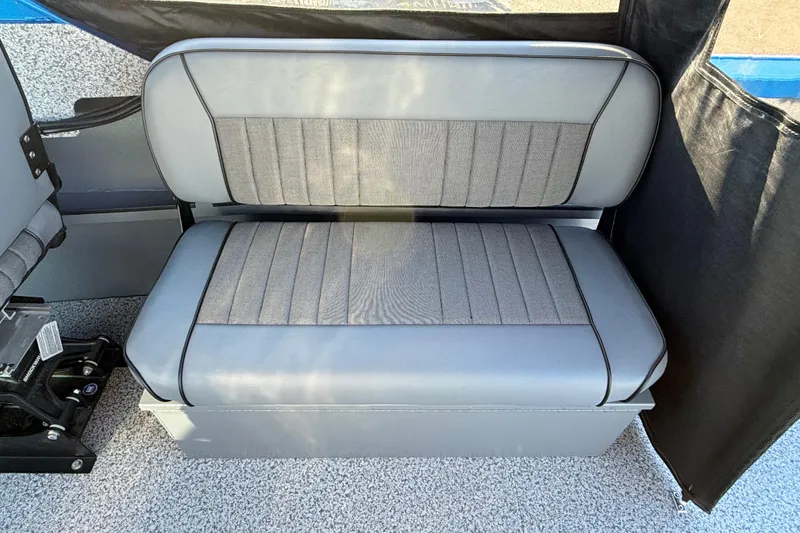 Slide: The Image of 2026 Alumaweld Intruder Outboard 22 boat seat, gray upholstery, interior view. - 21