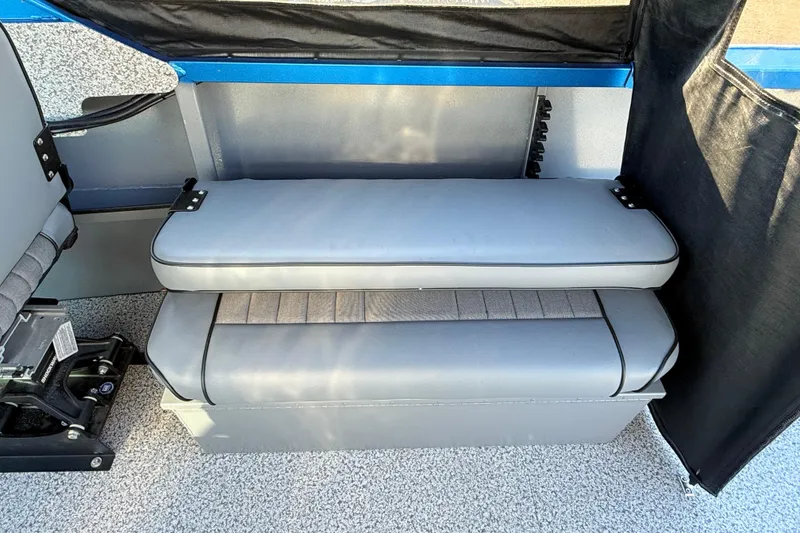 Slide: The Image of Interior seating of 2026 Alumaweld Intruder Outboard 22 boat, featuring gray cushioned bench. - 22