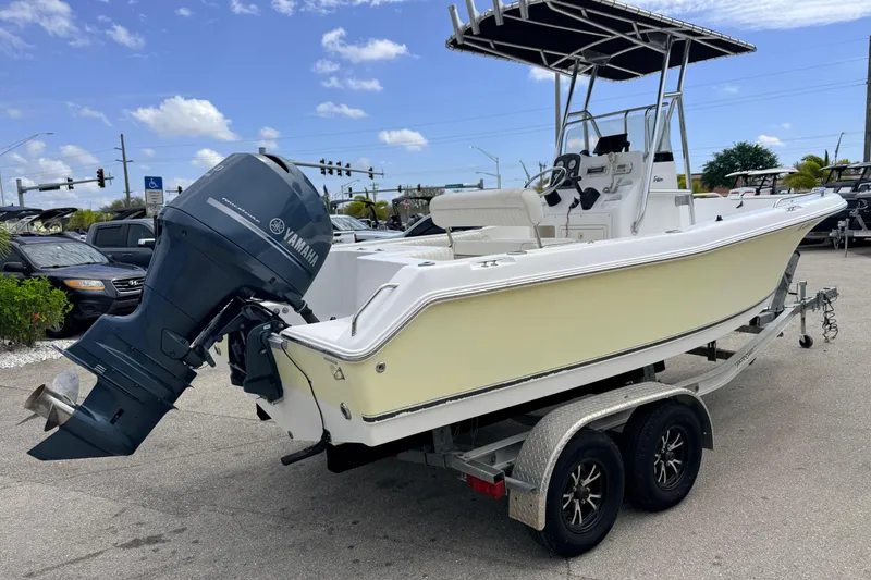 Slide: The Image of 2007 Sea Hunt Triton 220 boat on trailer with Yamaha outboard motor. - 4