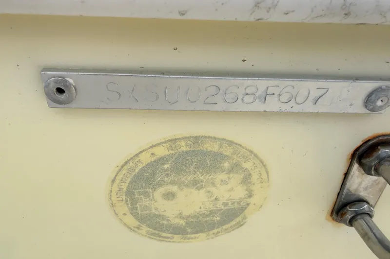 Slide: The Image of 2007 Sea Hunt Triton 220 hull identification number and faded sticker. - 17