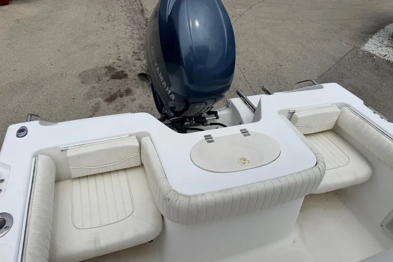 Slide: The Image of 2007 Sea Hunt Triton 220 boat with Yamaha outboard motor and white seating. - 9