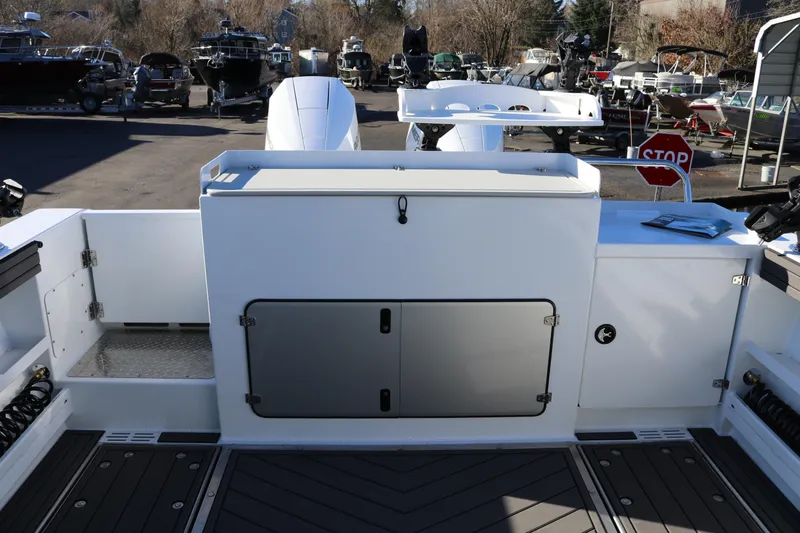 Slide: The Image of 2026 KingFisher 3425 GFX Offshore boat deck with storage compartments and equipment. - 11