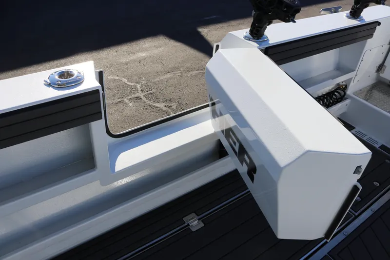 Slide: The Image of 2026 KingFisher 3425 GFX Offshore boat interior with rod holders and storage compartments. - 22