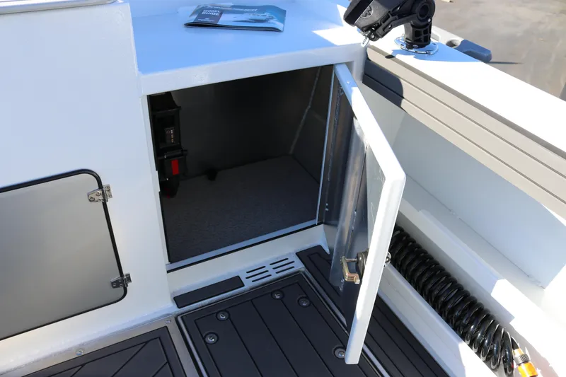 Slide: The Image of Open storage compartment on 2026 KingFisher 3425 GFX Offshore boat deck. - 24