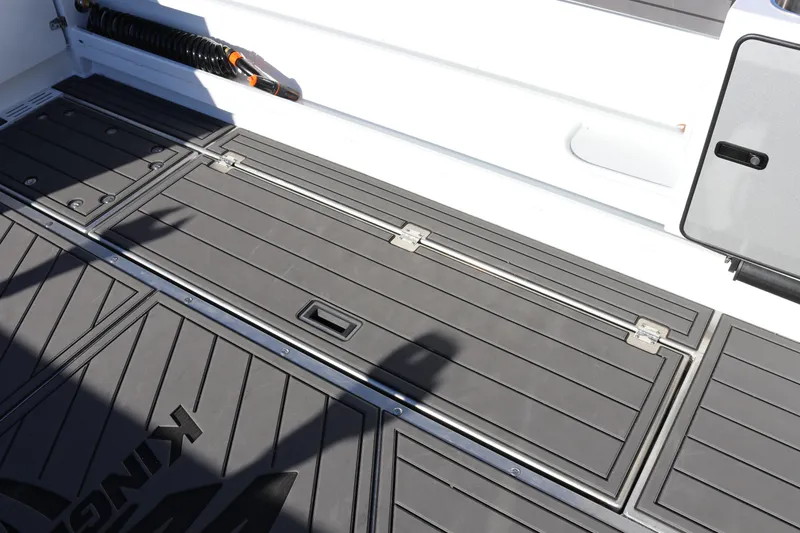Slide: The Image of Deck of 2026 KingFisher 3425 GFX Offshore boat with storage compartments. - 25