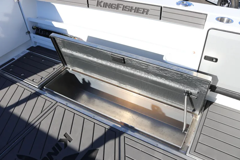 Slide: The Image of Open storage compartment on 2026 KingFisher 3425 GFX Offshore boat deck. - 26