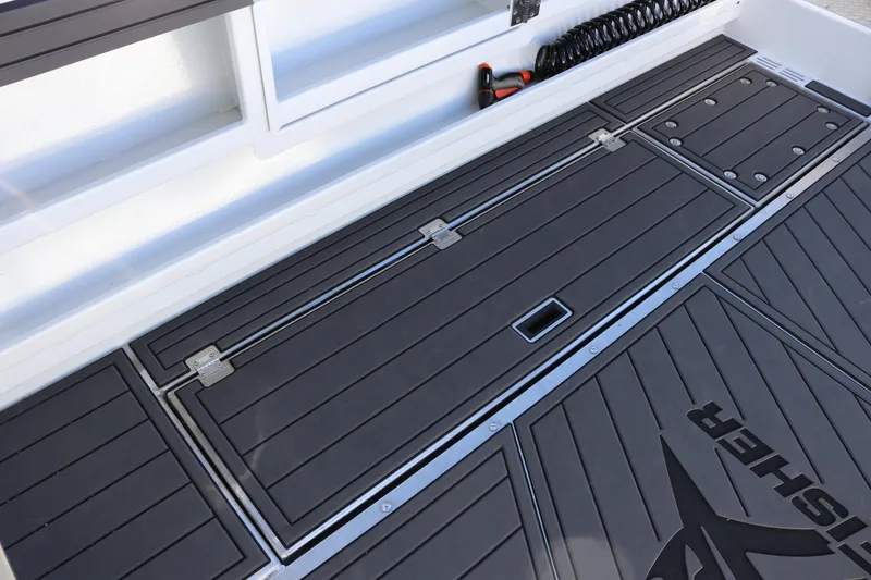Slide: The Image of KingFisher 3425 GFX Offshore 2026 boat deck with storage compartments and sleek design. - 27