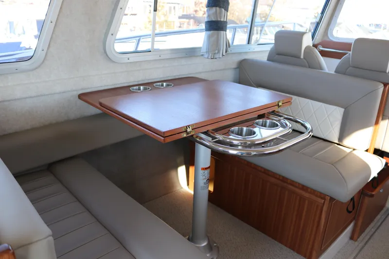 Slide: The Image of Interior of 2026 KingFisher 3425 GFX Offshore boat with seating and table. - 32