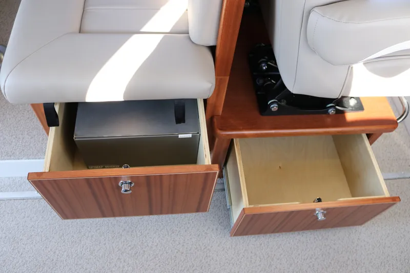 Slide: The Image of KingFisher 3425 GFX Offshore 2026 boat interior with open storage drawers. - 38