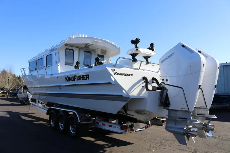 Slide: The Image of 2026 KingFisher 3425 GFX Offshore boat with dual Mercury engines on trailer. - 4