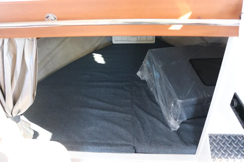 Slide: The Image of Interior cabin of 2026 KingFisher 3425 GFX Offshore boat, featuring cozy bedding. - 45