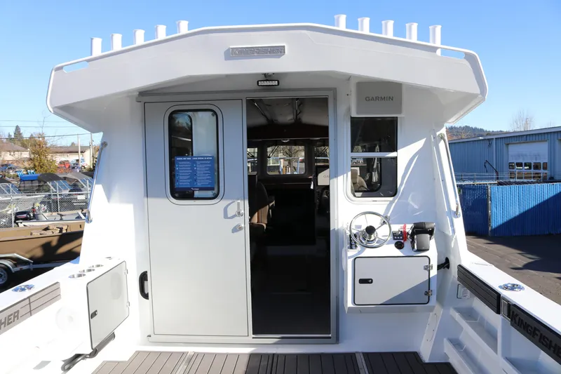 Slide: The Image of 2026 KingFisher 3425 GFX Offshore boat cockpit with Garmin equipment and modern design. - 8