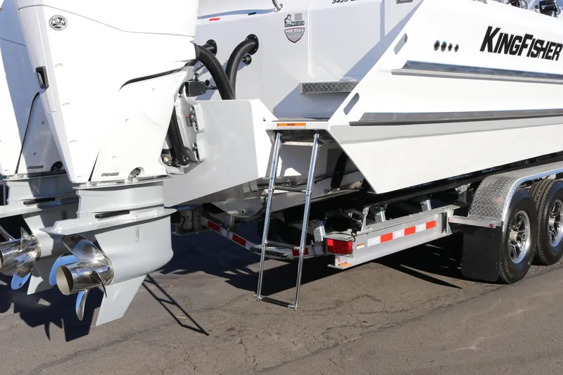 Slide: The Image of KingFisher 3425 GFX Offshore 2026 boat on trailer, featuring dual outboard motors. - 9
