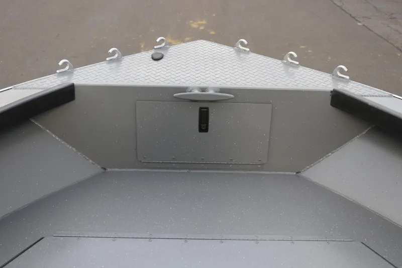 Slide: The Image of 2026 Alumaweld Columbia 23 boat interior with diamond plate deck and storage compartment. - 11