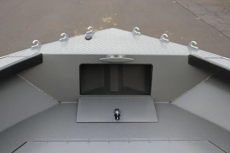 Slide: The Image of 2026 Alumaweld Columbia 23 boat interior, featuring a sturdy metal deck and storage compartment. - 12