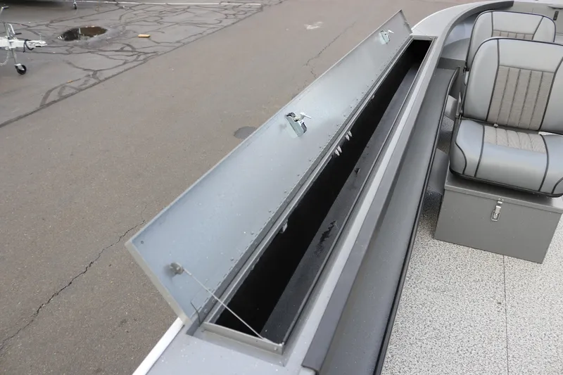 Slide: The Image of 2026 Alumaweld Columbia 23 boat interior with open storage compartment and seating. - 19