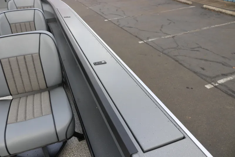 Slide: The Image of 2026 Alumaweld Columbia 23 boat interior with gray seating and sleek design. - 22