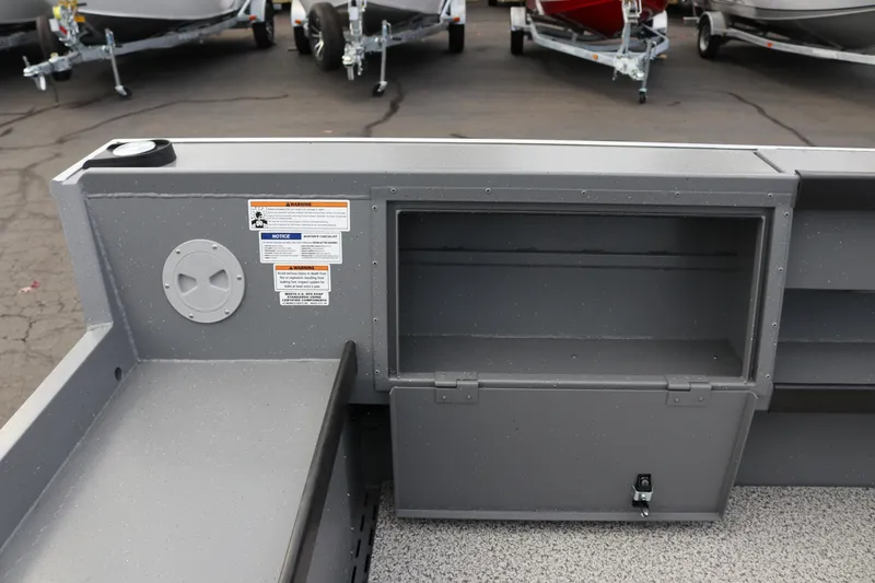 Slide: The Image of Interior view of 2026 Alumaweld Columbia 23 boat storage compartment and seating area. - 24