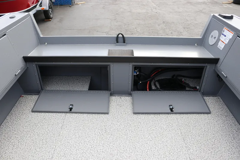 Slide: The Image of 2026 Alumaweld Columbia 23 boat interior with open storage compartments. - 28