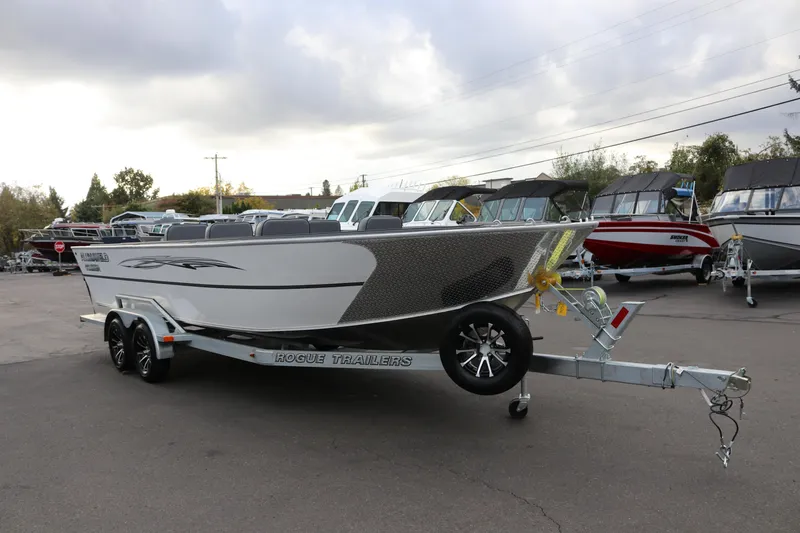 Slide: The Image of 2026 Alumaweld Columbia 23 boat on Rogue trailer in outdoor showroom. - 6