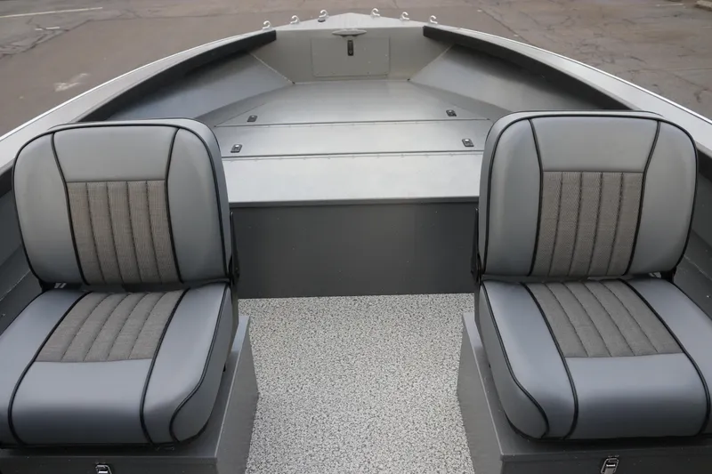 Slide: The Image of 2026 Alumaweld Columbia 23 boat interior with two gray seats and textured flooring. - 7