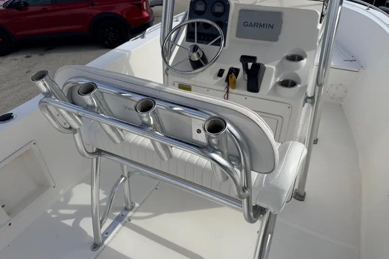 Slide: The Image of 2006 Sea Hunt Triton 220 boat interior with rod holders and Garmin navigation system. - 11