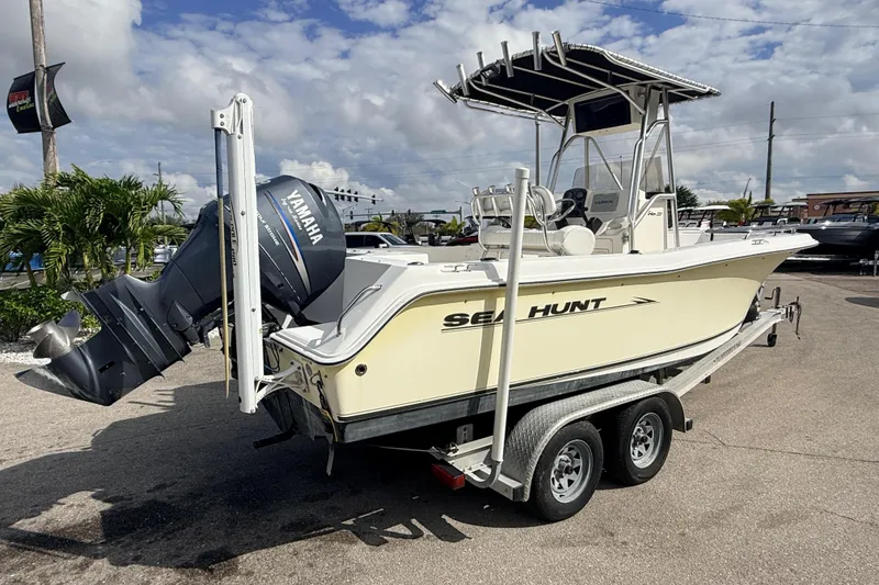 Slide: The Image of 2006 Sea Hunt Triton 220 boat on trailer with Yamaha outboard motor. - 5