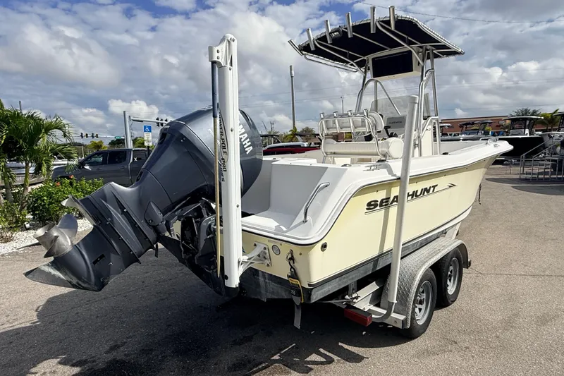 Slide: The Image of 2006 Sea Hunt Triton 220 boat on trailer with Yamaha outboard motor. - 6