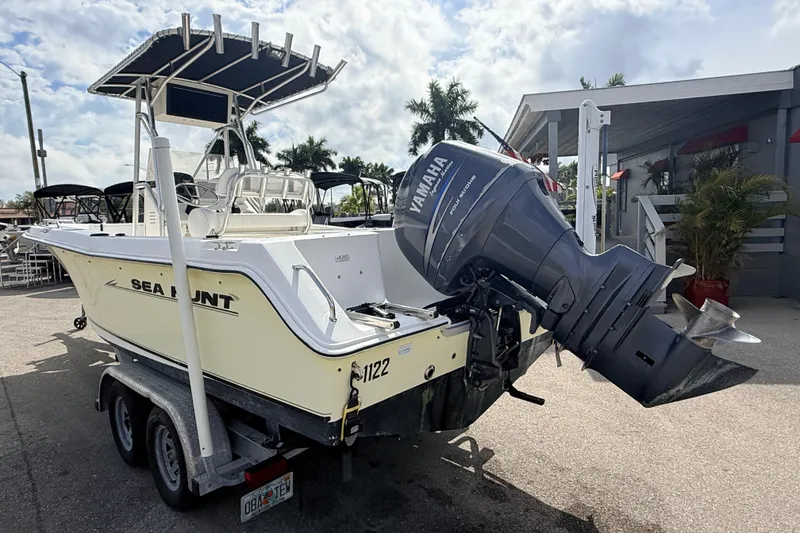 Slide: The Image of 2006 Sea Hunt Triton 220 boat with Yamaha outboard motor on trailer. - 8