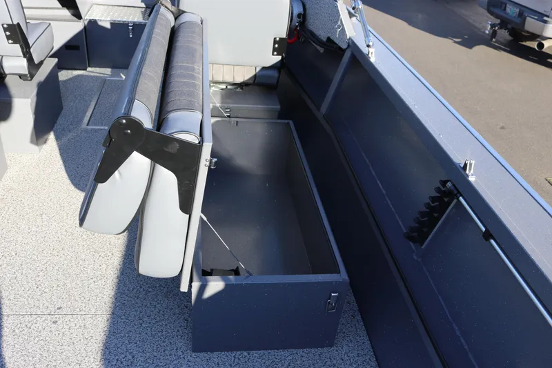 Slide: The Image of 2026 Alumaweld Intruder Outboard 20 boat interior with storage compartment and seating. - 11