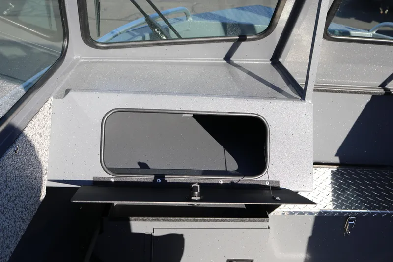 Slide: The Image of 2026 Alumaweld Intruder Outboard 20 boat dashboard with storage compartment. - 14