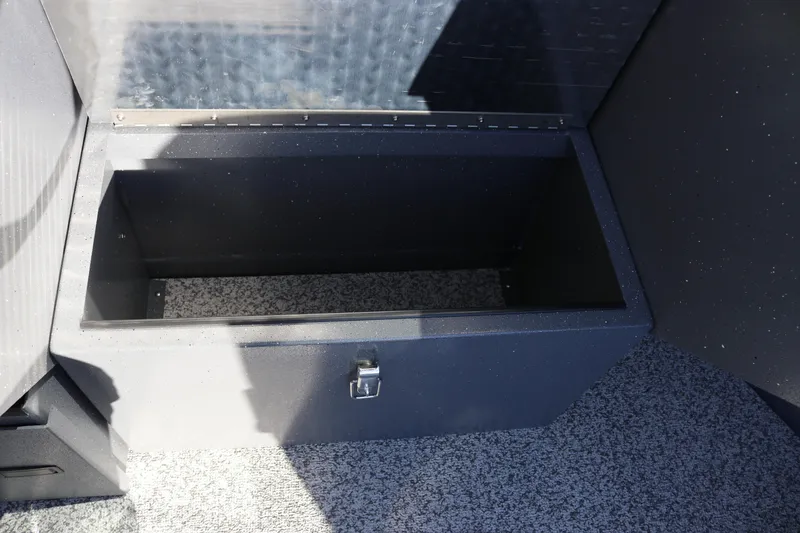 Slide: The Image of 2026 Alumaweld Intruder Outboard 20 storage compartment with open lid, showcasing interior space. - 17
