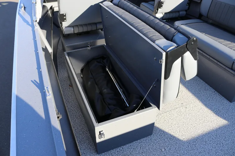 Slide: The Image of 2026 Alumaweld Intruder Outboard 20 boat interior with open storage compartment. - 23