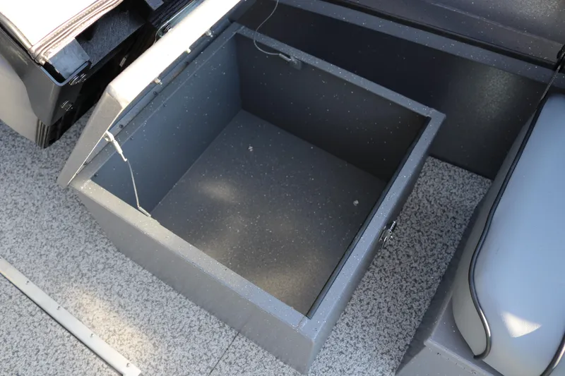 Slide: The Image of Open storage compartment in 2026 Alumaweld Intruder Outboard 20 boat interior. - 28