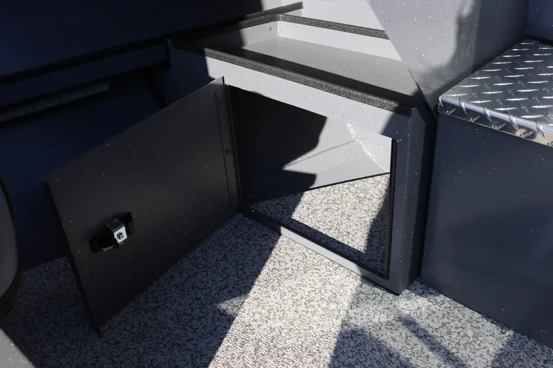 Slide: The Image of Open storage compartment in 2026 Alumaweld Intruder Outboard 20 boat interior. - 29