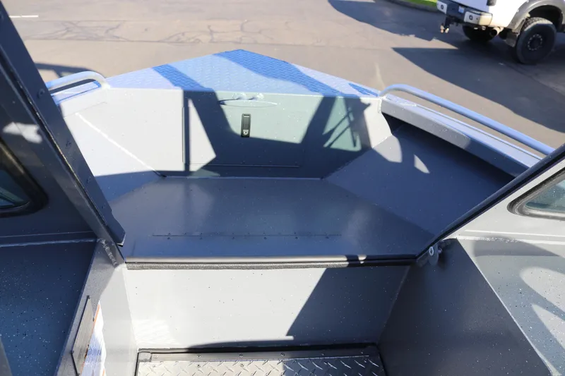 Slide: The Image of 2026 Alumaweld Intruder Outboard 20 boat interior with open bow and metal flooring. - 31