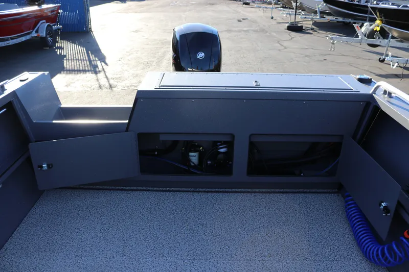 Slide: The Image of 2026 Alumaweld Intruder Outboard 20 boat interior with open storage compartments. - 35