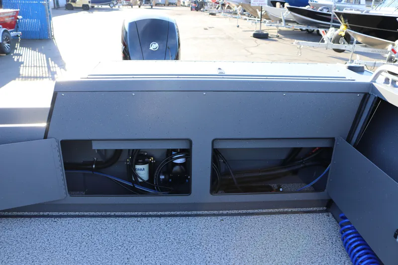 Slide: The Image of 2026 Alumaweld Intruder Outboard 20 boat interior with open storage compartments. - 36