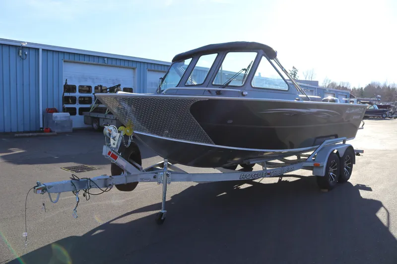 Slide: The Image of 2026 Alumaweld Intruder Outboard 20 boat on trailer in sunny outdoor setting. - 4