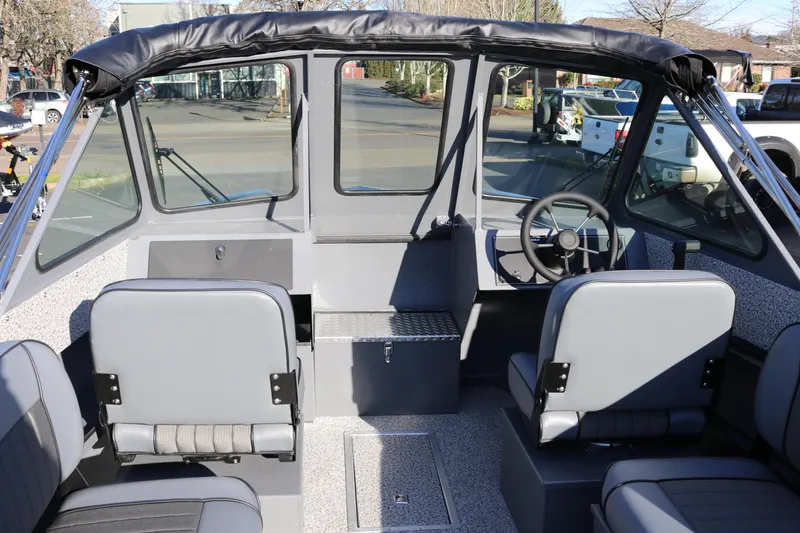 Slide: The Image of 2026 Alumaweld Intruder Outboard 20 interior with seating and steering wheel. - 8