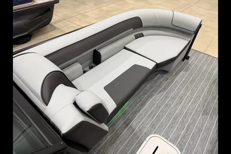 Slide: The Image of Luxurious seating on 2026 Premier 250 Solaris Sport boat, featuring sleek gray and white upholstery. - 10