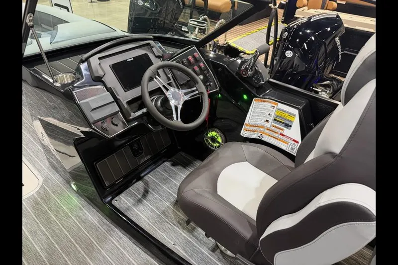 Slide: The Image of Interior of 2026 Premier 250 Solaris Sport boat with modern dashboard and seating. - 14