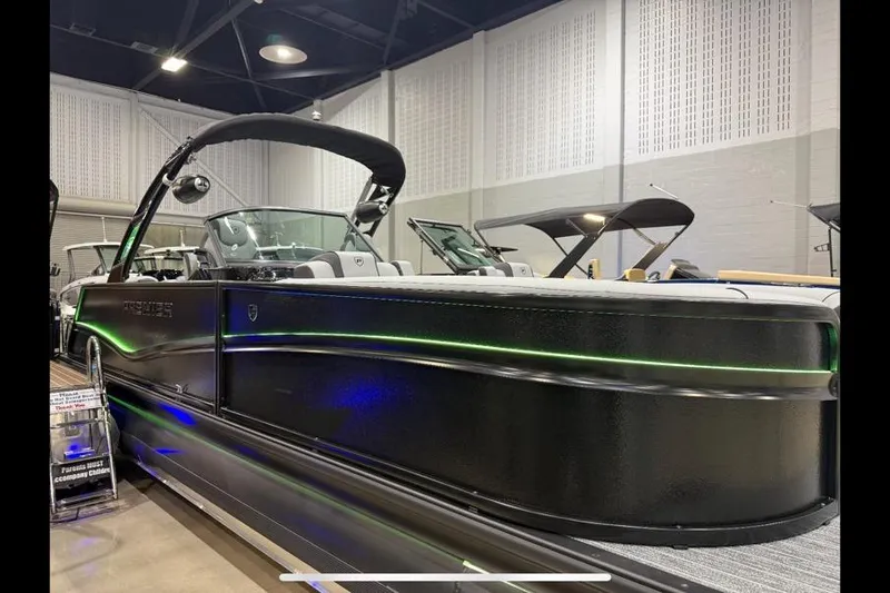 Slide: The Image of 2026 Premier 250 Solaris Sport pontoon boat with sleek black design and modern features. - 3