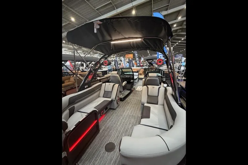 Slide: The Image of 2026 Premier 250 Solaris Sport pontoon boat interior with modern seating and canopy. - 5