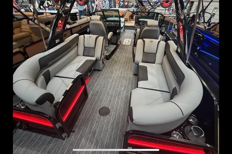 Slide: The Image of Luxurious interior of 2026 Premier 250 Solaris Sport pontoon boat with modern seating. - 7