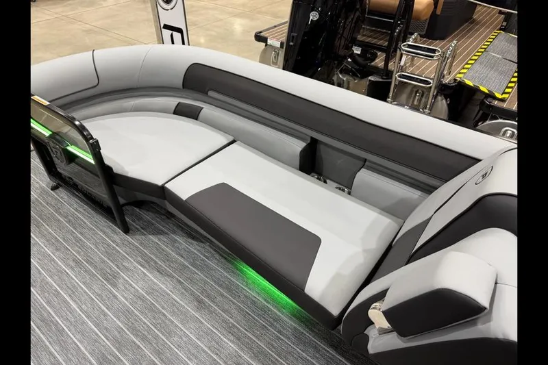 Slide: The Image of 2026 Premier 250 Solaris Sport boat interior with sleek gray seating and ambient lighting. - 9