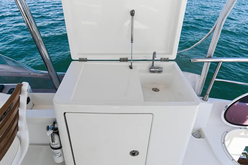 Slide: The Image of Outdoor sink on 2013 Azimut Magellano 50 yacht, overlooking ocean waters. - 14